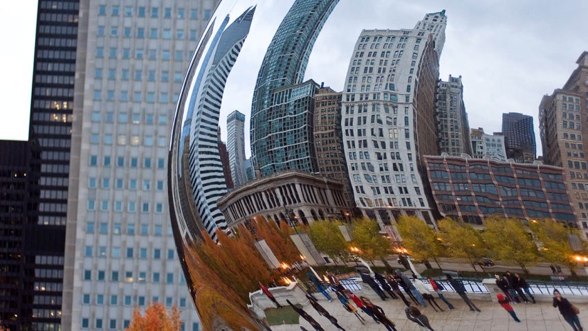 CHICAGO, IL — NOVEMBER 20:  A general view of the Chicago skyline reflected in the Cloud Gate sculpture in Millennium Park on November 11, 2011 in Chicago.  (Photo by Timothy Hiatt/Getty Images)