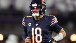 MINNEAPOLIS, MINNESOTA – DECEMBER 16: Quarterback Caleb Williams #18 of the Chicago Bears warms up prior to a game against the Minnesota Vikings at U.S. Bank Stadium on December 16, 2024 in Minneapolis, Minnesota. (Photo by David Berding/Getty Images)