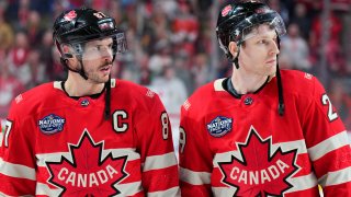 MONTREAL, QUEBEC – FEBRUARY 12: Sidney Crosby #87 and Nathan MacKinnon #29 of Team Canada look on after the 4 Nations Face-Off game between Canada and Sweden at Bell Centre on February 12, 2025 in Montreal, Quebec. Team Canada defeated Team Sweden in overtime 4-3. (Photo by Andre Ringuette/4NFO/World Cup of Hockey via Getty Images)