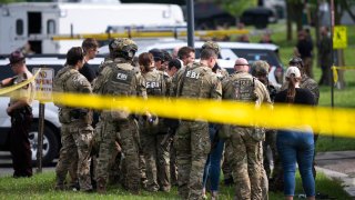 GREEN ISLE, MINNESOTA – JUNE 15: FBI agents stage in a neighborhood on June 15, 2025 in Green Isle, Minnesota. Law enforcement agencies are searching for Vance Boelter, a suspect in the killing of DFL State Rep. Melissa Hortman and her husband, Mark Hortman, who were shot at their home yesterday. DFL State Sen. John Hoffman and his wife were also shot and hospitalized in a separate incident. Minnesota Gov. Tim Walz said during a press conference that the shooting “appears to be a politically motivated assassination.” (Photo by Stephen Maturen/Getty Images)