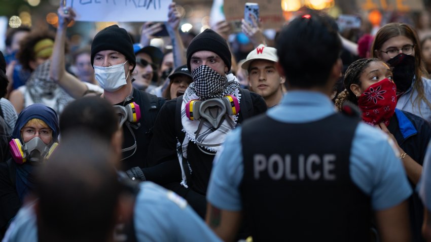 CHICAGO, ILLINOIS – JUNE 10: Police face off with immigrant rights protesters in the Loop on June 10, 2025 in Chicago, Illinois. The protest is one of many sparking up around the country as the Trump administration pushes to increase apprehensions of immigrants.   (Photo by Scott Olson/Getty Images)